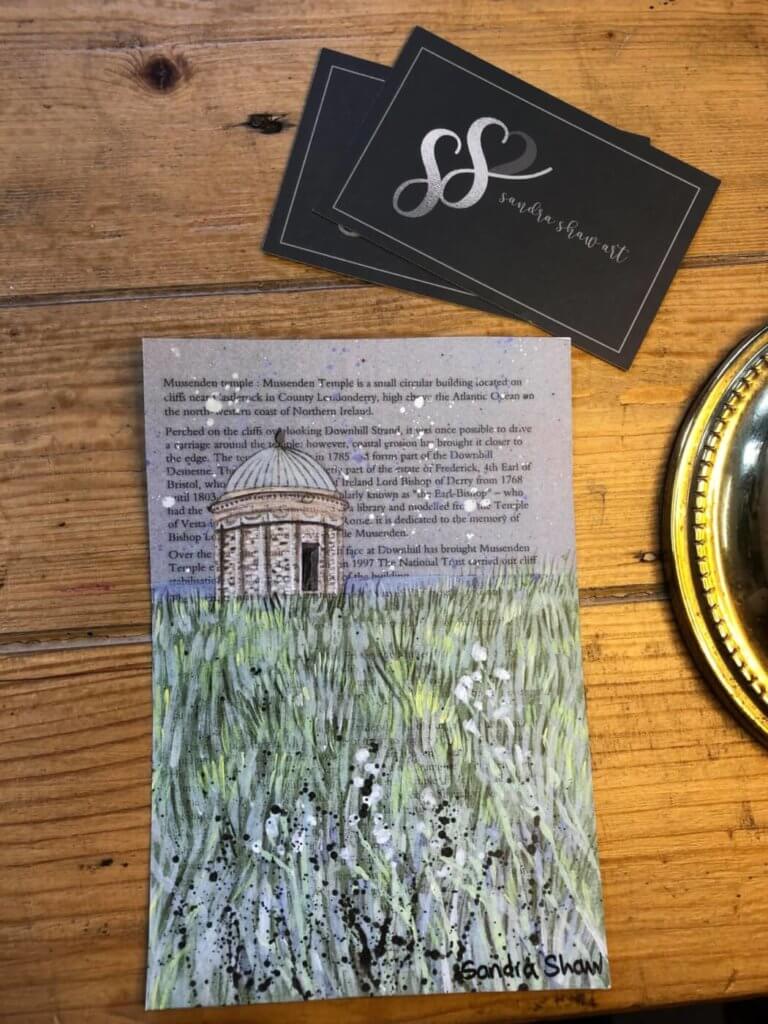 a print of mussendun temple with a poem in the background.