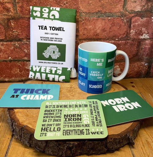 norn iron phrases on coasters, mugs, and tea towels in green